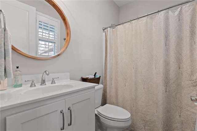 bathroom featuring vanity and toilet