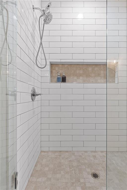 full bath featuring a shower stall