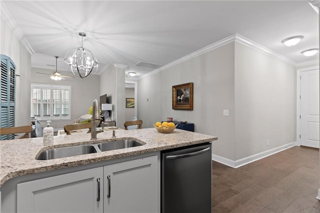 kitchen with a sink, decorative light fixtures, dark wood finished floors, crown molding, and dishwashing machine