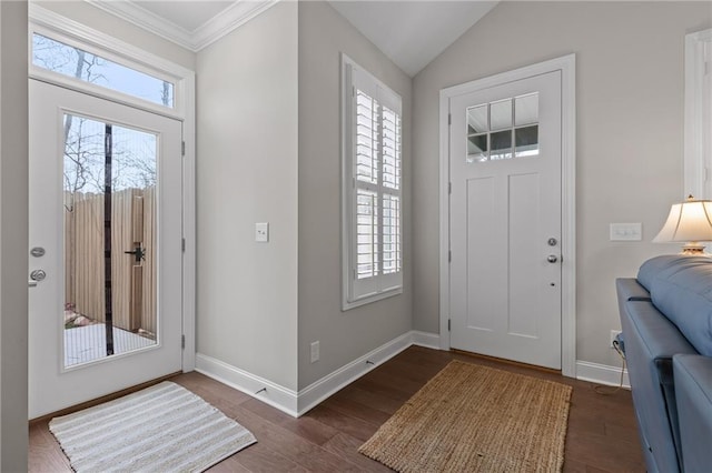 entrance foyer featuring baseboards, dark wood-style floors, crown molding, and vaulted ceiling