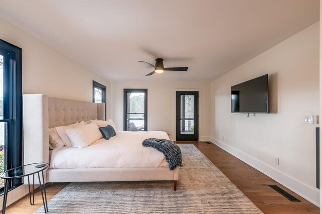 bedroom featuring dark wood-type flooring and ceiling fan