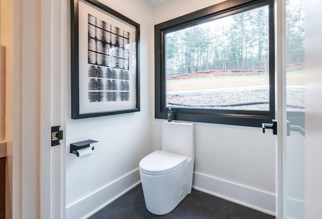 bathroom featuring tile patterned floors and toilet