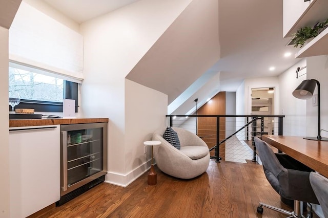 office area featuring wood-type flooring and beverage cooler