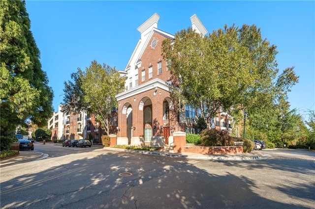 view of front of house featuring brick siding