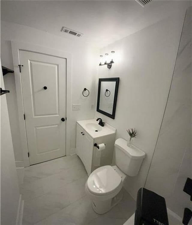 2022 Detroit Ave, Atlanta, GA 30314 - bathroom with marble finish floor, visible vents, toilet, and vanity