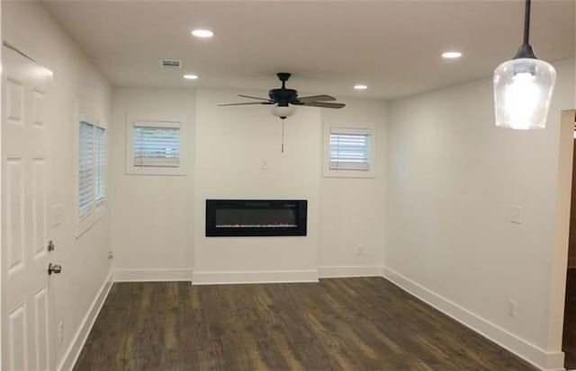 2022 Detroit Ave, Atlanta, GA 30314 - unfurnished living room with recessed lighting, dark wood-style flooring, ceiling fan, visible vents, and a glass covered fireplace