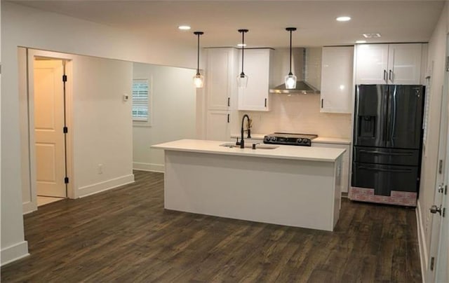 2022 Detroit Ave, Atlanta, GA 30314 - kitchen featuring white cabinets, a sink, black fridge with ice dispenser, and wall chimney exhaust hood