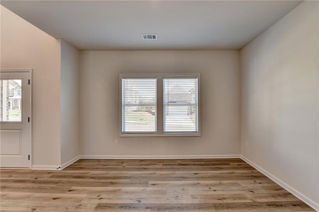 unfurnished room featuring light wood-type flooring