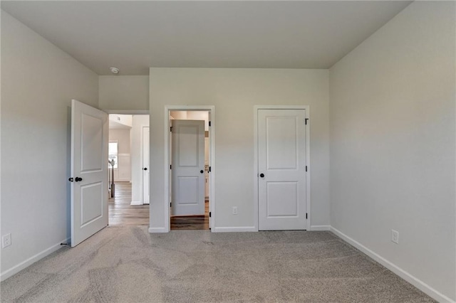 unfurnished bedroom with light carpet