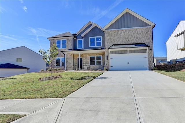 craftsman-style home featuring a garage and a front yard