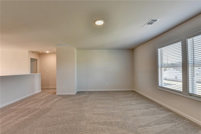 empty room with light colored carpet