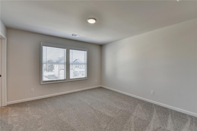 spare room featuring carpet floors