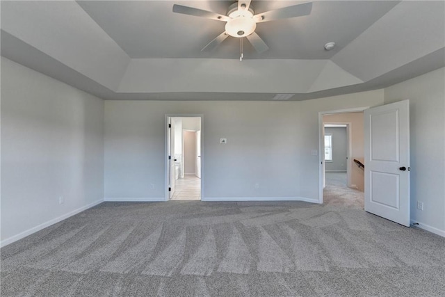 carpeted empty room featuring lofted ceiling and ceiling fan