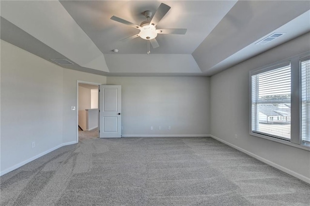 carpeted empty room with ceiling fan and vaulted ceiling