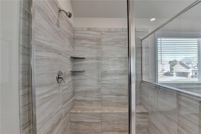 bathroom with a tile shower