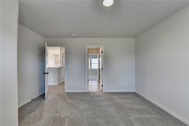 unfurnished bedroom featuring light carpet