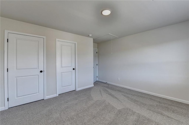 unfurnished bedroom with light carpet