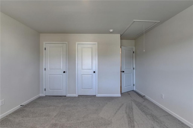 unfurnished bedroom with light colored carpet