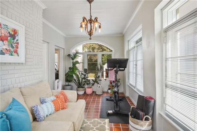 interior space featuring ornamental molding, a chandelier, and a healthy amount of sunlight