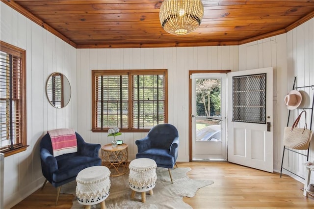 sitting room featuring wood ceiling, a healthy amount of sunlight, and light wood-type flooring