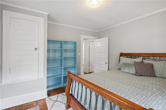 bedroom featuring dark parquet floors and ornamental molding