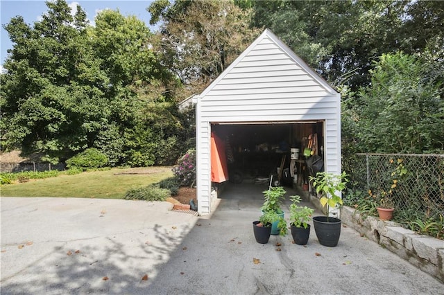 garage featuring a lawn