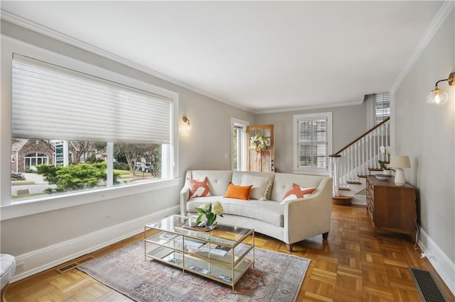 living room featuring ornamental molding and parquet floors