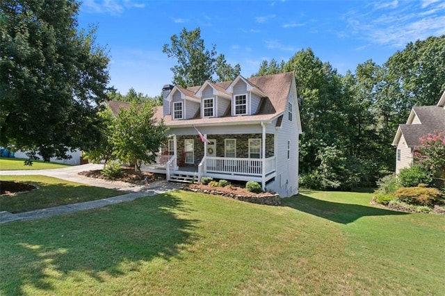 cape cod home featuring a front lawn and covered porch