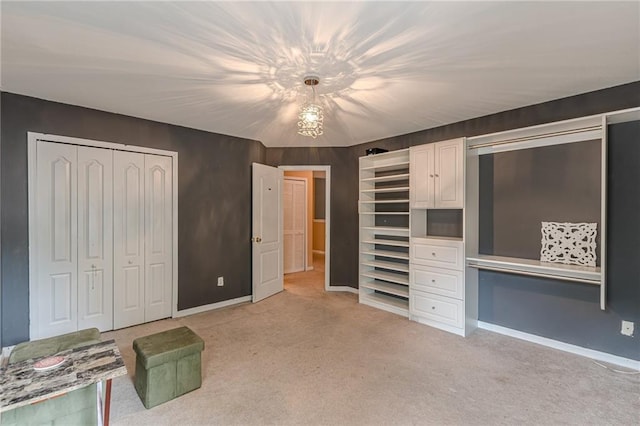 unfurnished bedroom with a closet, light carpet, and baseboards