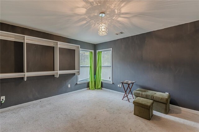 unfurnished bedroom featuring light colored carpet and a closet