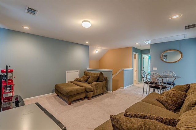 living room featuring baseboards, recessed lighting, visible vents, and light colored carpet