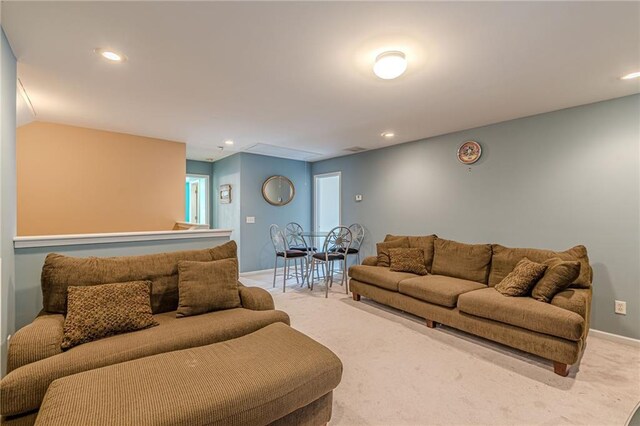 living room featuring light carpet