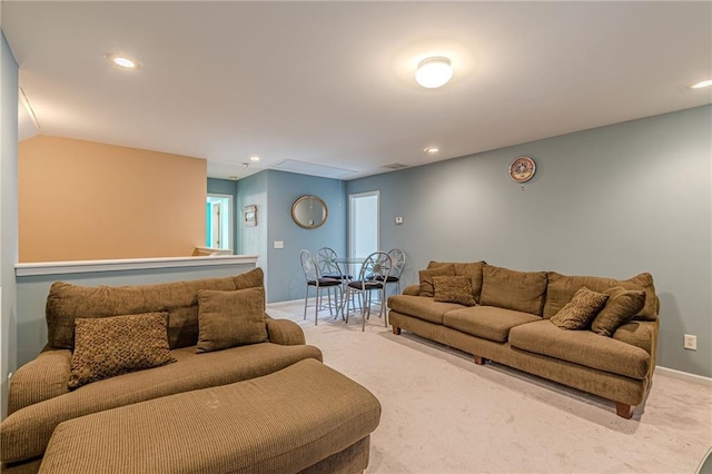 living room featuring carpet, baseboards, and recessed lighting