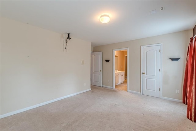 empty room with light carpet and baseboards