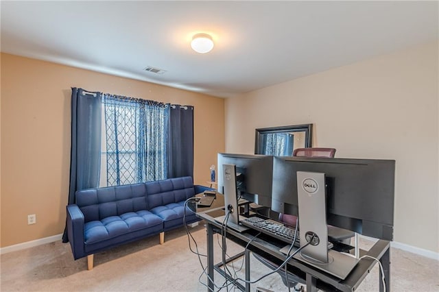 office area featuring carpet floors, visible vents, and baseboards