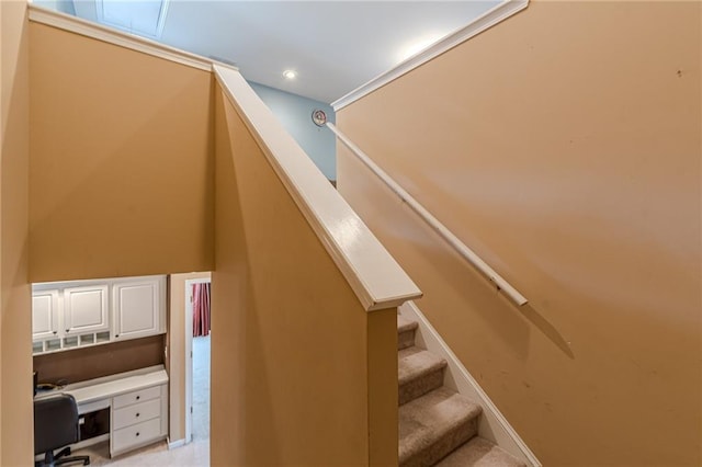 stairway with carpet floors, baseboards, built in desk, and recessed lighting