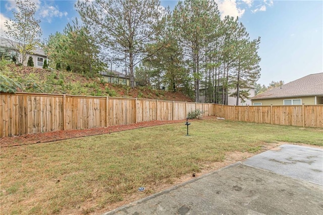 view of yard with a fenced backyard and a patio