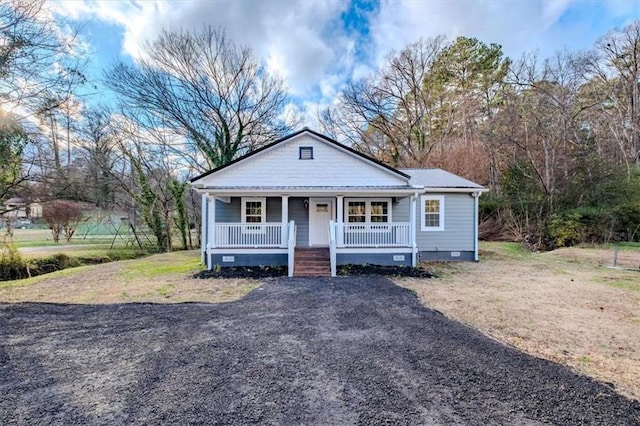 bungalow-style home with crawl space and covered porch