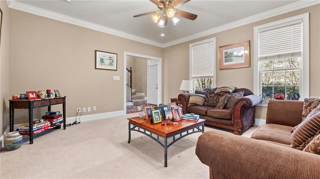 living area with a ceiling fan, crown molding, stairway, carpet floors, and baseboards
