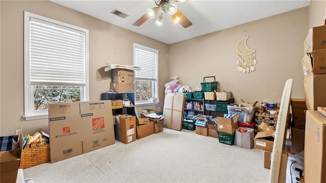 storage featuring a ceiling fan and visible vents