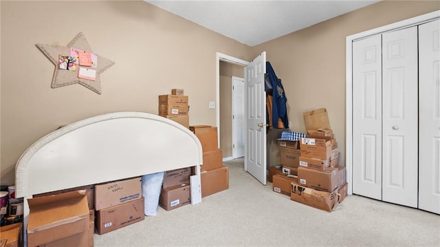 carpeted bedroom with a closet