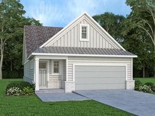 view of front facade featuring a front yard and a garage