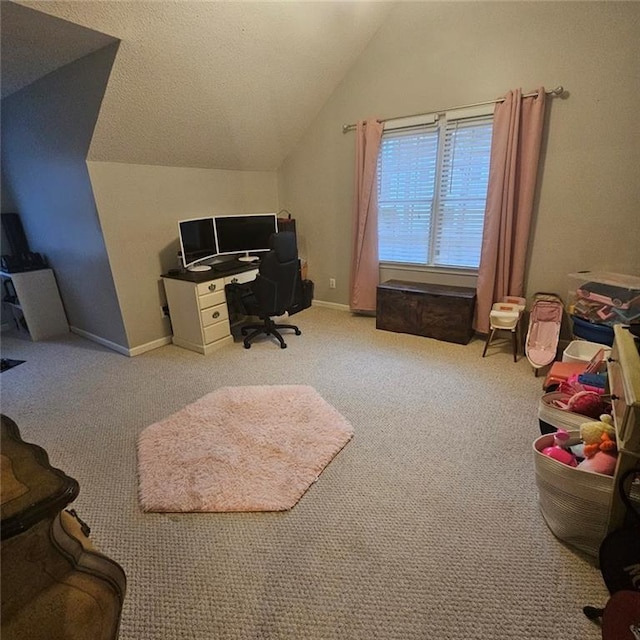 home office with light colored carpet and lofted ceiling