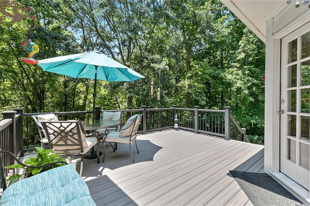 4875 Rivercliff Trce SW, Lilburn, GA 30047 - wooden deck with outdoor dining space and view of scattered trees