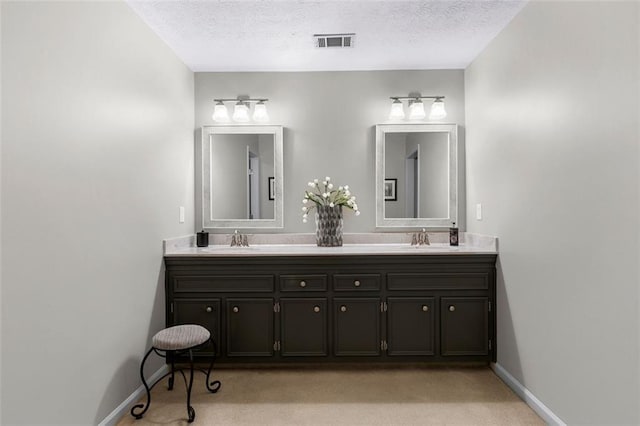 4875 Rivercliff Trce SW, Lilburn, GA 30047 - bathroom with double vanity and a textured ceiling