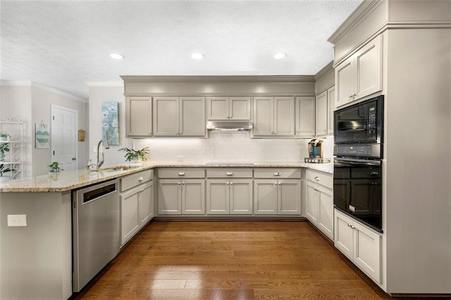 4875 Rivercliff Trce SW, Lilburn, GA 30047 - kitchen featuring black appliances, a peninsula, ornamental molding, a textured ceiling, and under cabinet range hood