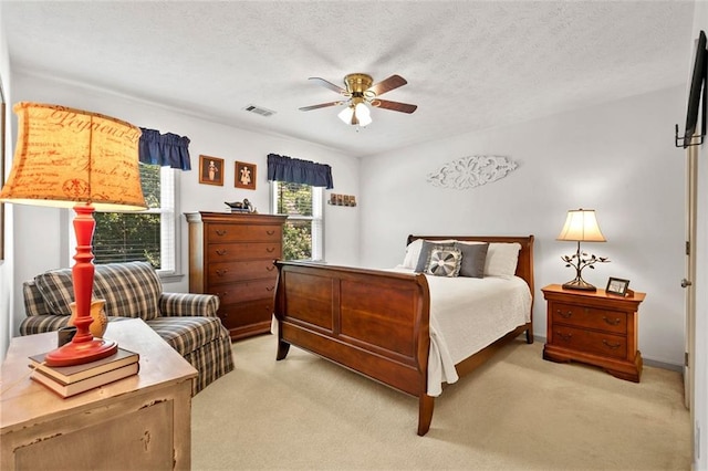 4875 Rivercliff Trce SW, Lilburn, GA 30047 - bedroom with multiple windows, light carpet, ceiling fan, and a textured ceiling