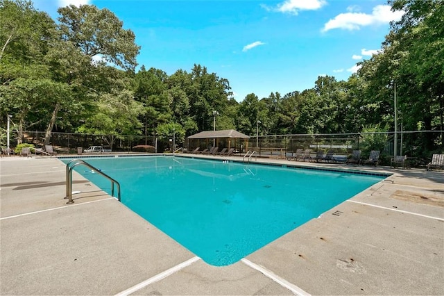 4875 Rivercliff Trce SW, Lilburn, GA 30047 - community pool with a patio and view of scattered trees