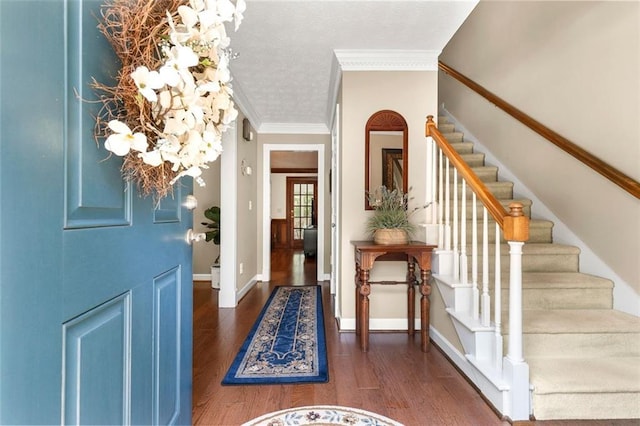 4875 Rivercliff Trce SW, Lilburn, GA 30047 - entryway featuring crown molding, wood finished floors, and stairway
