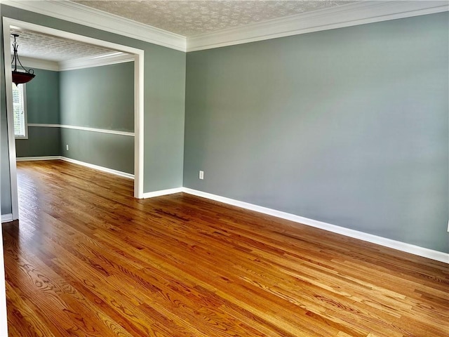 10175 Hemlock Way, Jonesboro, GA 30238 - empty room with baseboards, wood finished floors, and ornamental molding